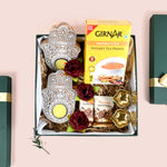 Riwaz Celebration Luxury Festive Gift Hamper | Instant Tea Premix, Almond Brittle, Brass Shankh Chakra Diya, Tealight Holders & Rose Decor |