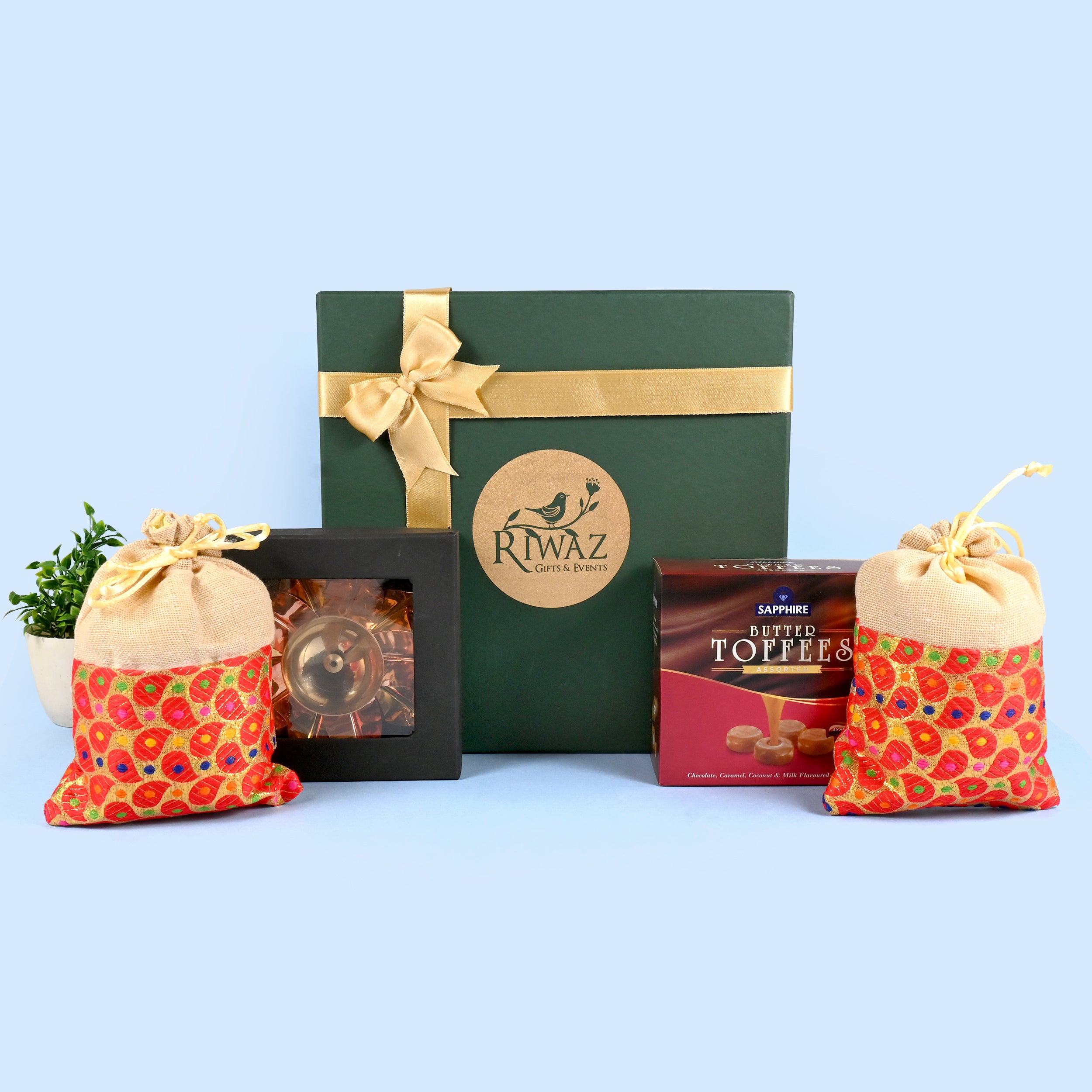 Riwaz Celebration Traditional Gift Hamper | Sapphire Butter Toffees, Ethnic Potli Bags & Brass Diya in Keepsake Box