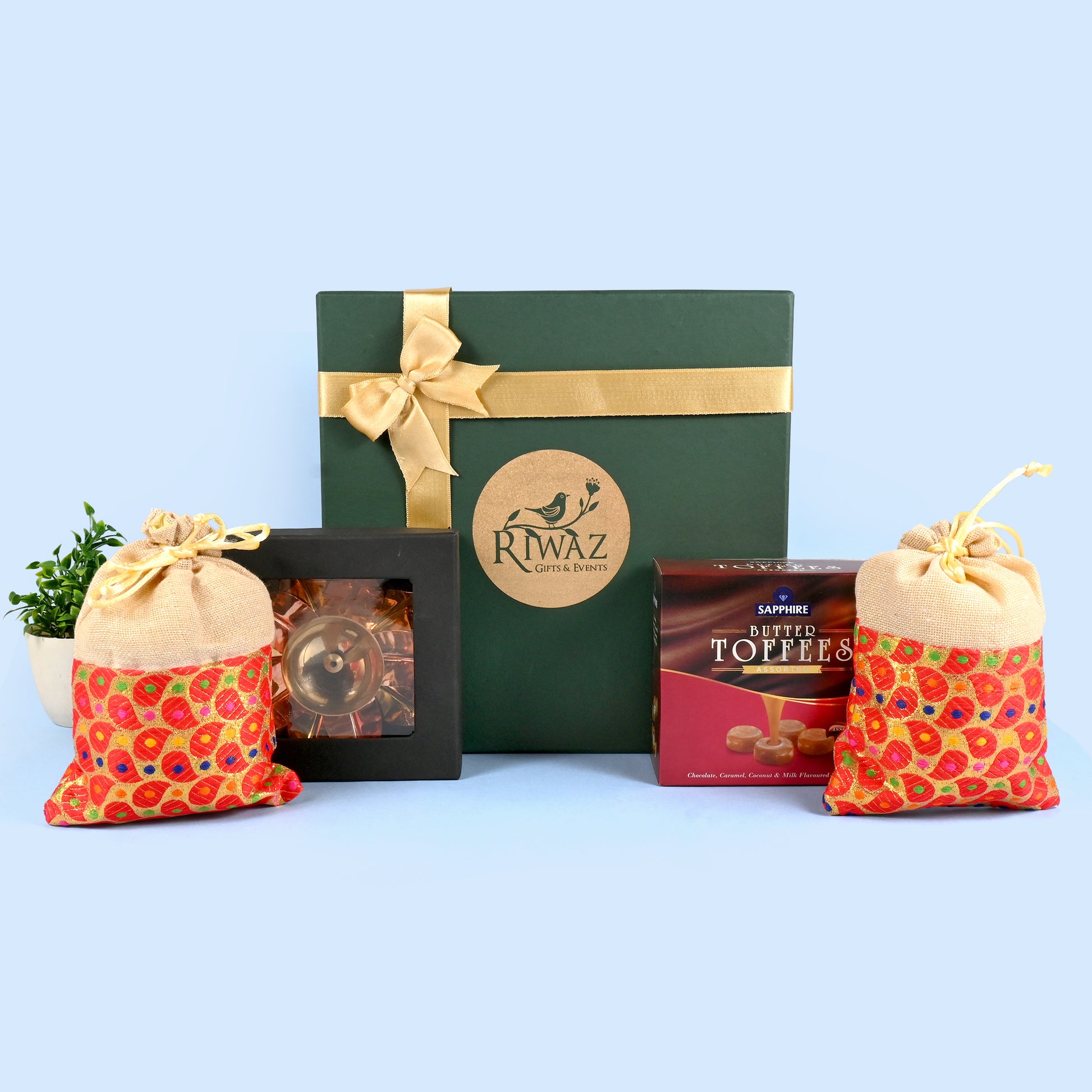 Riwaz Celebration Traditional Gift Hamper | Sapphire Butter Toffees, Ethnic Potli Bags & Brass Diya in Keepsake Box | Luxurious Festive Gift for Diwali, Rakhi, Wedding, Return Gifts & Family Celebrations