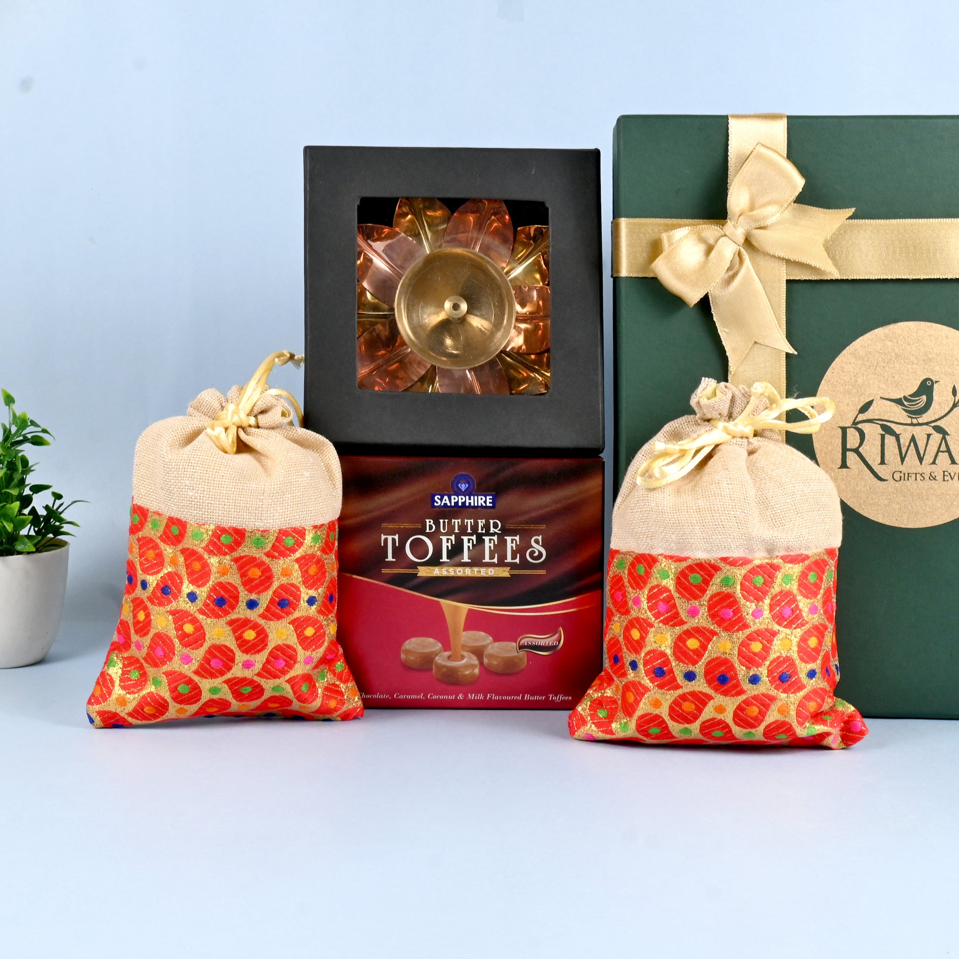Riwaz Celebration Traditional Gift Hamper | Sapphire Butter Toffees, Ethnic Potli Bags & Brass Diya in Keepsake Box | Luxurious Festive Gift for Diwali, Rakhi, Wedding, Return Gifts & Family Celebrations