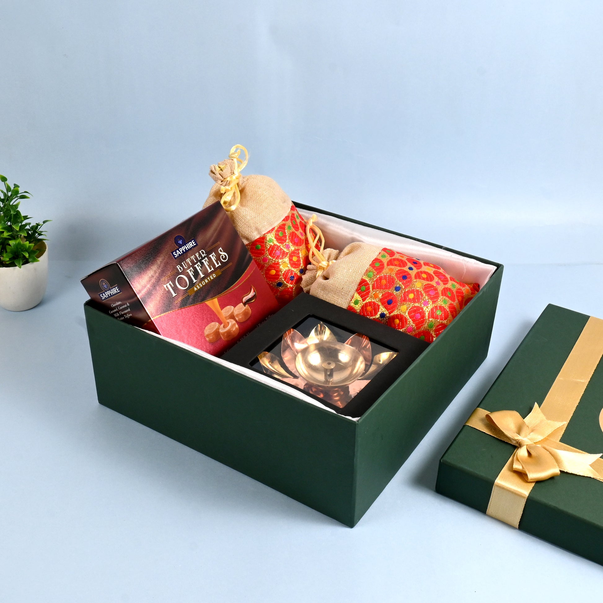 Riwaz Celebration Traditional Gift Hamper | Sapphire Butter Toffees, Ethnic Potli Bags & Brass Diya in Keepsake Box | Luxurious Festive Gift for Diwali, Rakhi, Wedding, Return Gifts & Family Celebrations