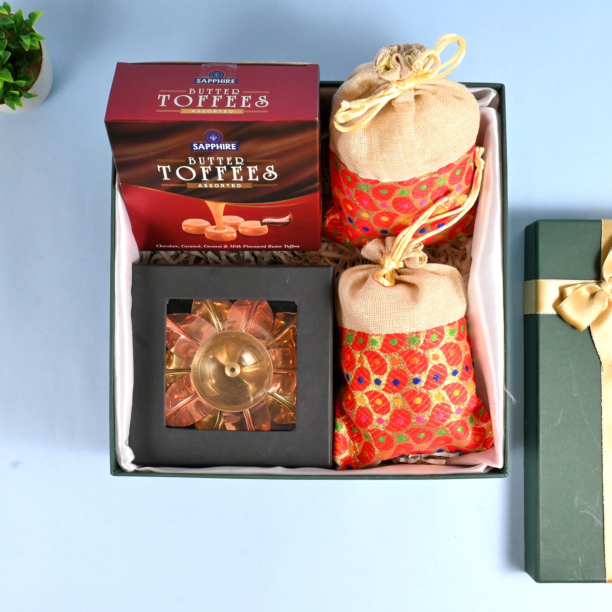 Riwaz Celebration Traditional Gift Hamper | Sapphire Butter Toffees, Ethnic Potli Bags & Brass Diya in Keepsake Box | Luxurious Festive Gift for Diwali, Rakhi, Wedding, Return Gifts & Family Celebrations